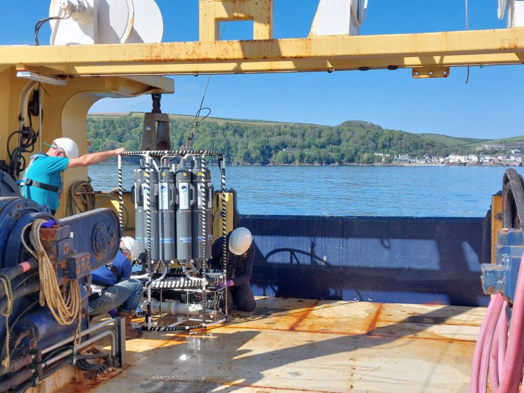 Scientists capture water samples from the rosette