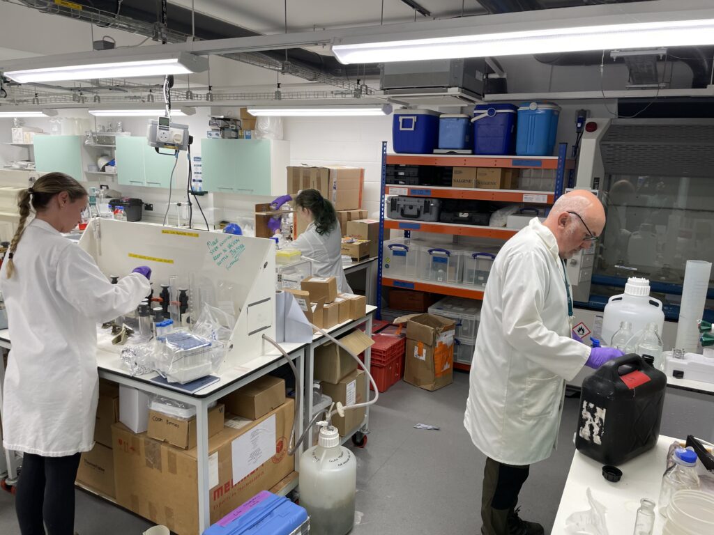 Scientists processing the samples in the lab